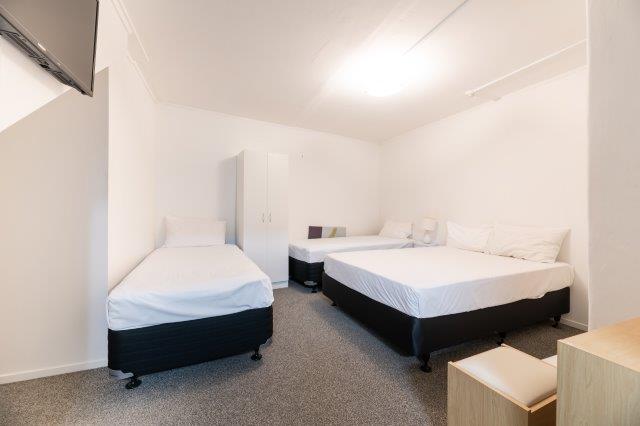 Family room with Queen and two single beds